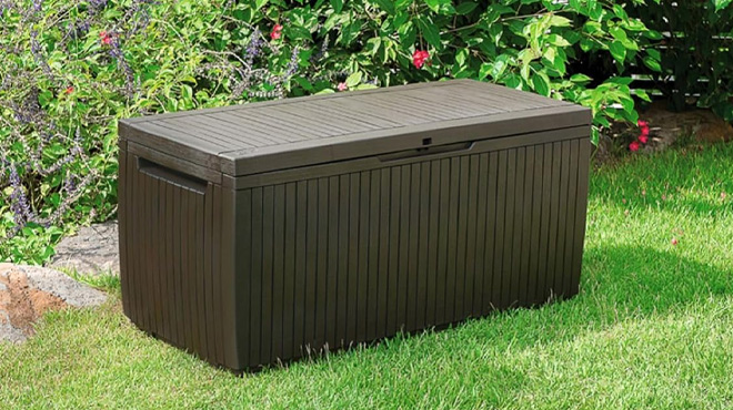 Keter Springwood 80 Gallon Resin Outdoor Storage Box in the Grass