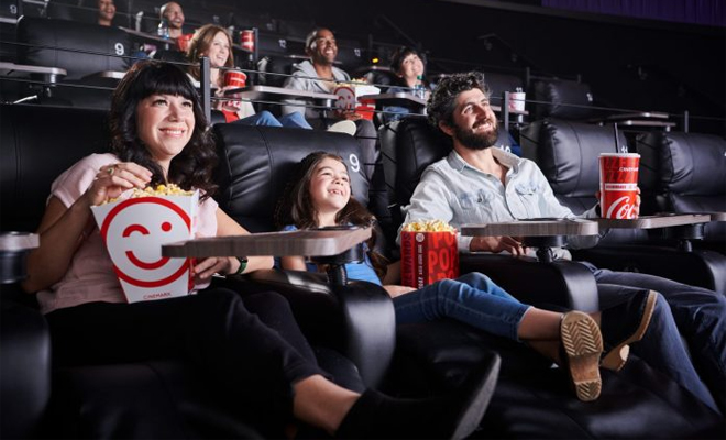 People Sitting at Cinemark Cinema Watching a Movie and Eating Popcorn