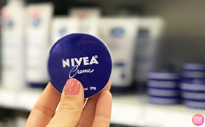 Person Holding Nivea Creme 1 Ounce