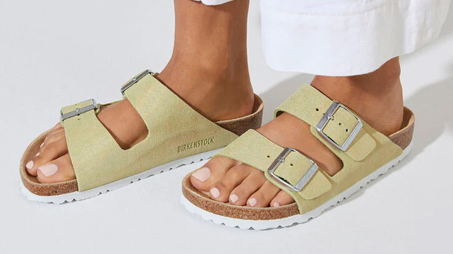 a Person Wearing Birkenstock Arizona Shimmer Suede Sandals