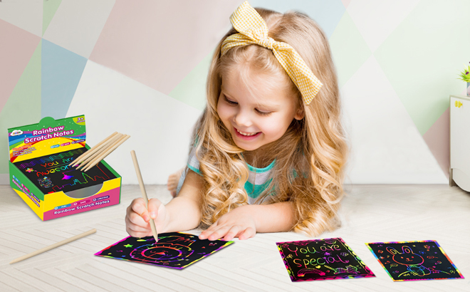 A Child Drawing Using Rainbow Scratch Mini Art Notes