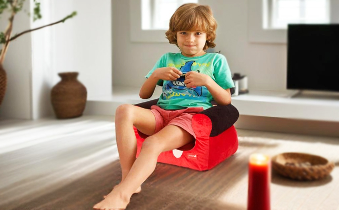 A Child Sitting on a Mickey Mouse Bean Bag