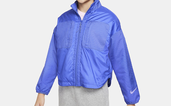 A Girl Wearing Nike Sportswear Therma FIT Repel Shirt Jacket