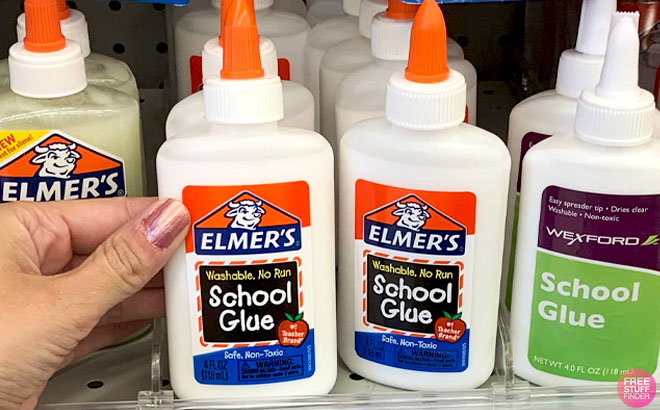 A Hand holding Elmers Liquid School Glue