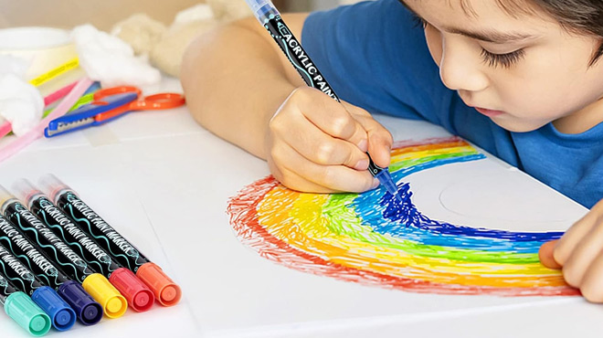 A Kid Drawing a Rainbow using a Colpart Acrylic Paint Pens Markers