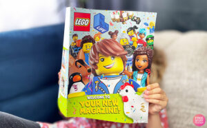 A Kid Reading a LEGO Magazine