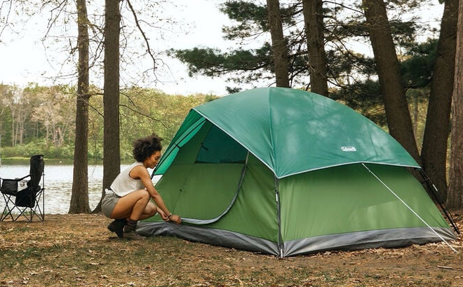 A Lady Setting up her Coleman Sundome 4 Person Camping Tent