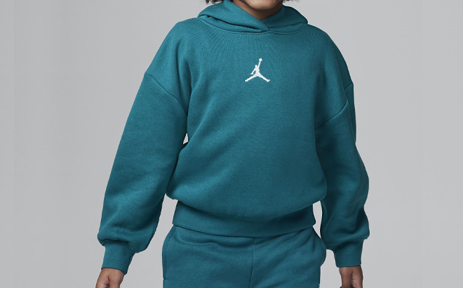 A Little Girl Wearing Nike Jordan Icon Play Pullover Hoodie