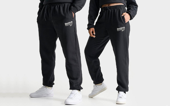 A Man and Woman Wearing Reebok Stack Logo Jogger Pants