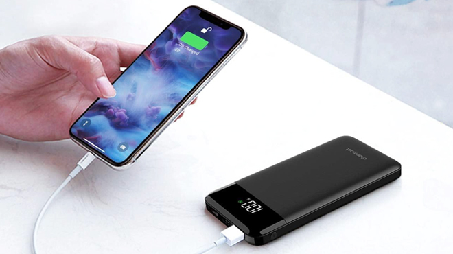 A Person Charging a Mobile Phone to Charmast Portable Charger Power Bank