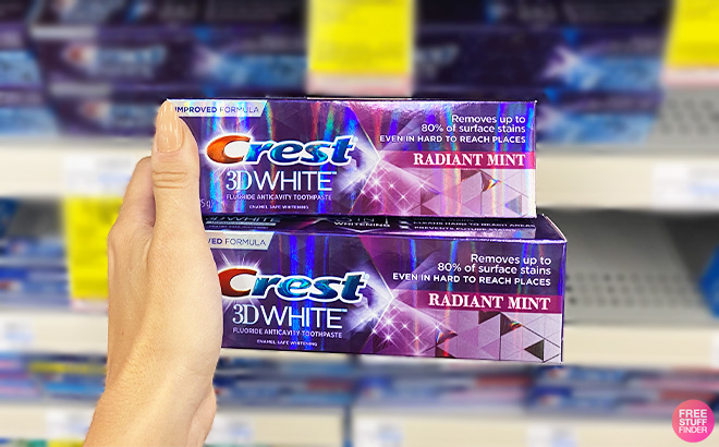 A Person Holding Crest 3D White Toothpastes 1