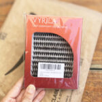 A Person Holding a Box of Vyrila Lash Extension Clusters