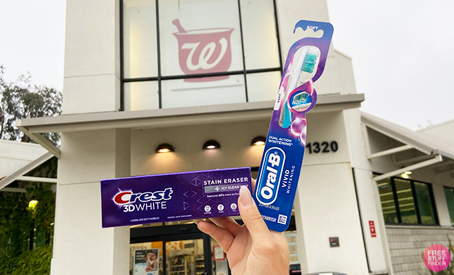 A Person Holding a Crest 3D White Stain Eraser Toothpaste in Icy Clean Mint Flavor and a Oral B Vivid Whitening Manual Toothbrush at Walgreens