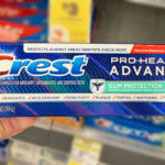 A Person Holding a Crest Pro Health Advanced Gum Protection Toothpaste