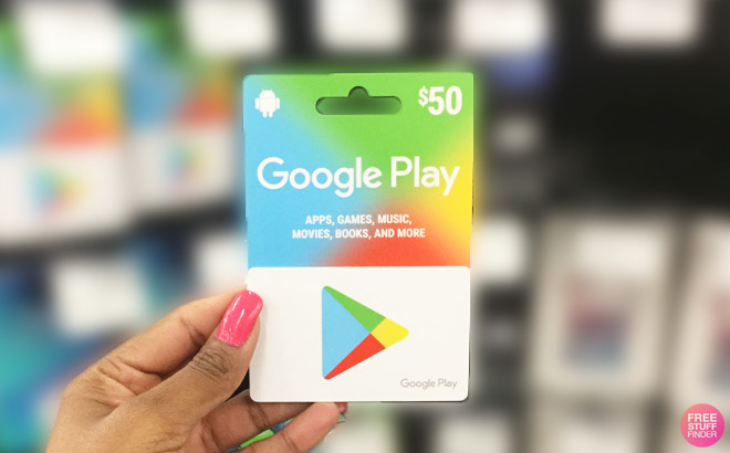 A Person Holding a Google Play Gift Card Inside a Store