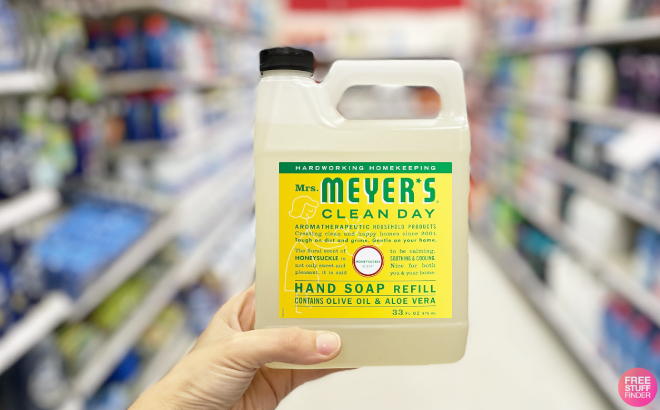 A Person Holding a Mrs Meyers Clean Day Liquid Hand Soap Refill