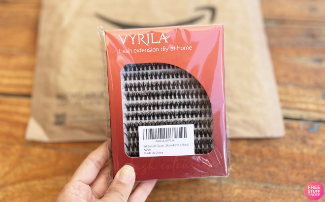 A Person Holding a Pack of Vyrila Lash Extension Clusters