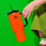 A Person Holding a Stanley 40 Ounce Tumbler in Neon Orange