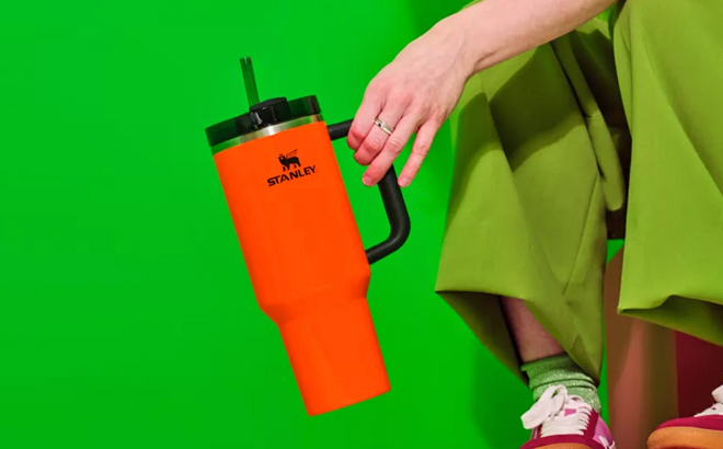 A Person Holding a Stanley 40 Ounce Tumbler in Neon Orange