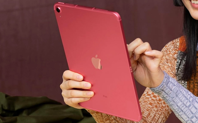 A Person Holding an Apple 10 9 Inch iPad in Pink Color