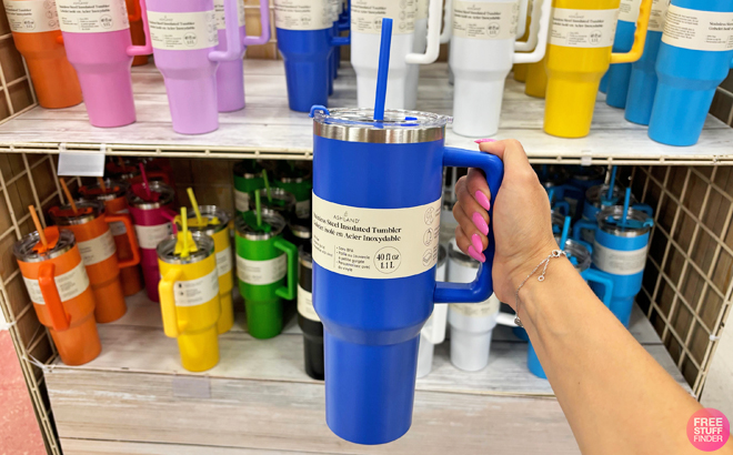 A Person Holding an Ashland Insulated Tumbler in Dark Blue