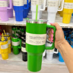 A Person Holding an Ashland Insulated Tumbler in Green