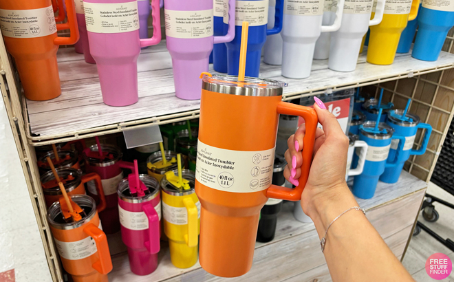 A Person Holding an Ashland Insulated Tumbler in Peach