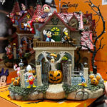 A Person Holding the Disney Halloween Party House with Lights Music at Costco