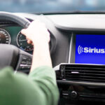 A Person Listening to SiriusXM Radio in the Car