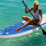 A Person Riding FunWater Inflatable Stand Up Paddle Board