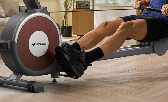 A Person Using the Merach Magnetic Rower Machine at Home