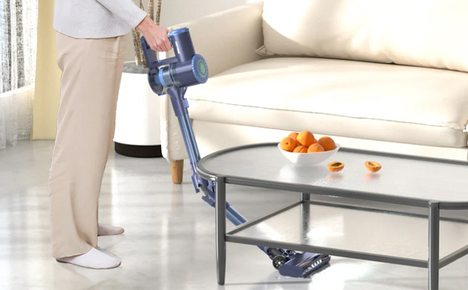 A Person Using the Prettycare Cordless Vacuum Cleaner