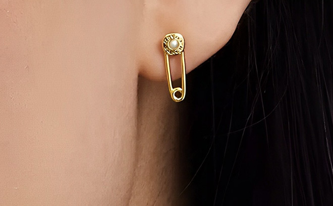 A Person Wearing Coach Outlet Safety Pin Stud Earrings