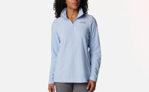 A Person Wearing Columbia Womens Lake Aloha Half Zip Fleece Pullover in Whisper Color
