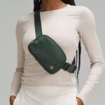 A Person Wearing Lululemon Belt Bag in Legacy Green