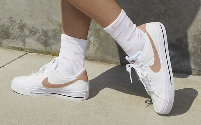 A Person Wearing Nike Court Legacy Next Nature Womens Shoes