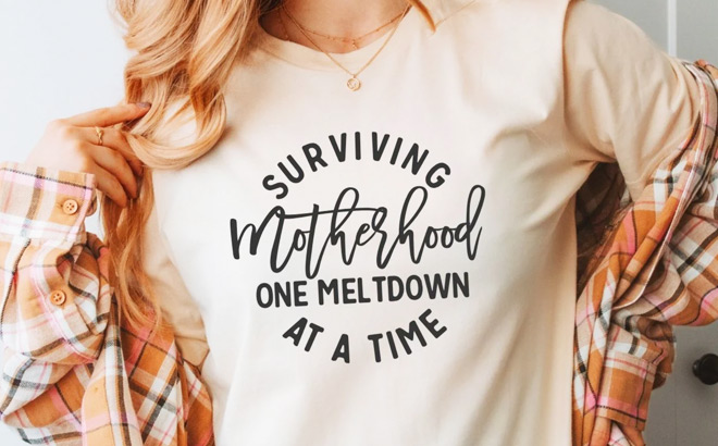 A Person Wearing a Surviving Motherhood Tee