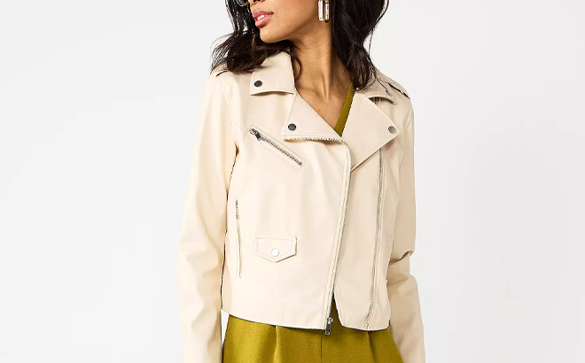 A Person Wearing the Nine West Faux Leather Moto Jacket in Beige