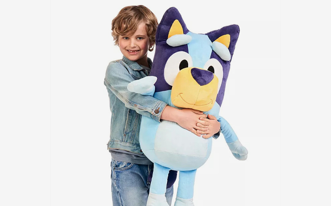 A Person holding a 36 Inch Bluey Plush