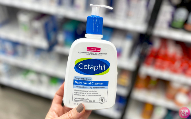 A Person holding a bottle of Cetaphil Facial Cleanser 