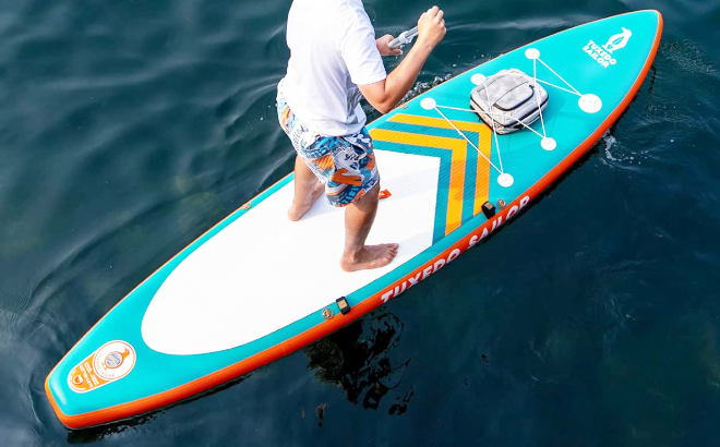 A Person on a Tuxedo Sailor Inflatable Ultra Light Stand Up Paddle Board