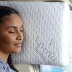 A Person sleeping on Vaverto Memory Foam Pillow on a Plane