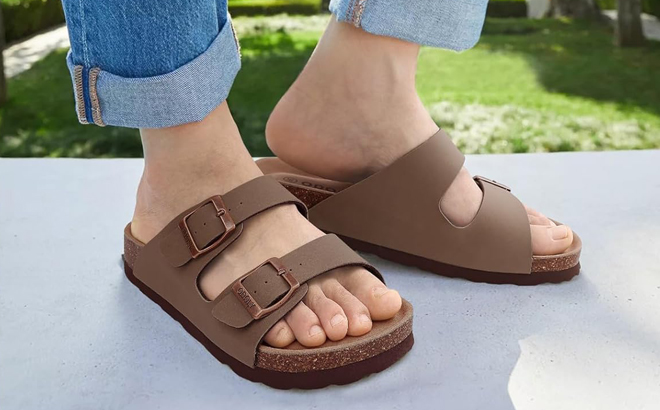 A Person wearing ODOLY Womens Cork Footbed Slide Sandals
