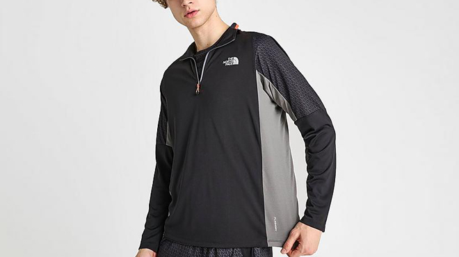 A Person wearing The North Face Performance Quarter zip Mens Top