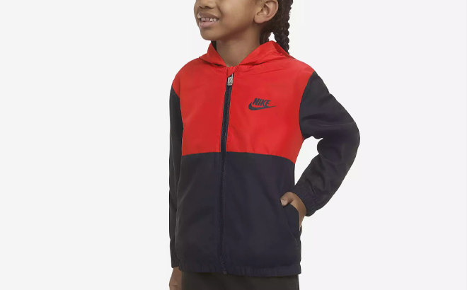 A Person wearing a Nike Boys Dri FIT Futura Windrunner Jacket