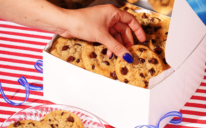 A Woman Holding Tiff’s Treats Chocolate Chip Cookies