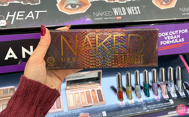 A Woman Holding Urban Decay Naked Wild West Palette