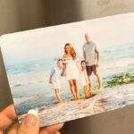 A Woman Holding a 5x7 Photo Magnet