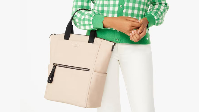 A Woman Wearing Kate Spade Chelsea Convertible Backpack