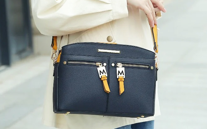 A Woman Wearing MKF Collection Zoely Crossbody Bag